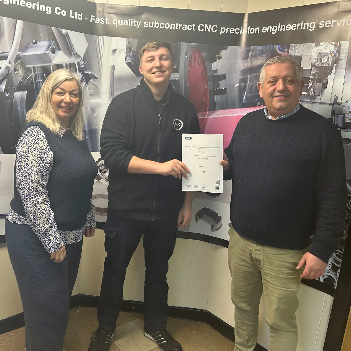 Kyle receiving his apprenticeship certificate